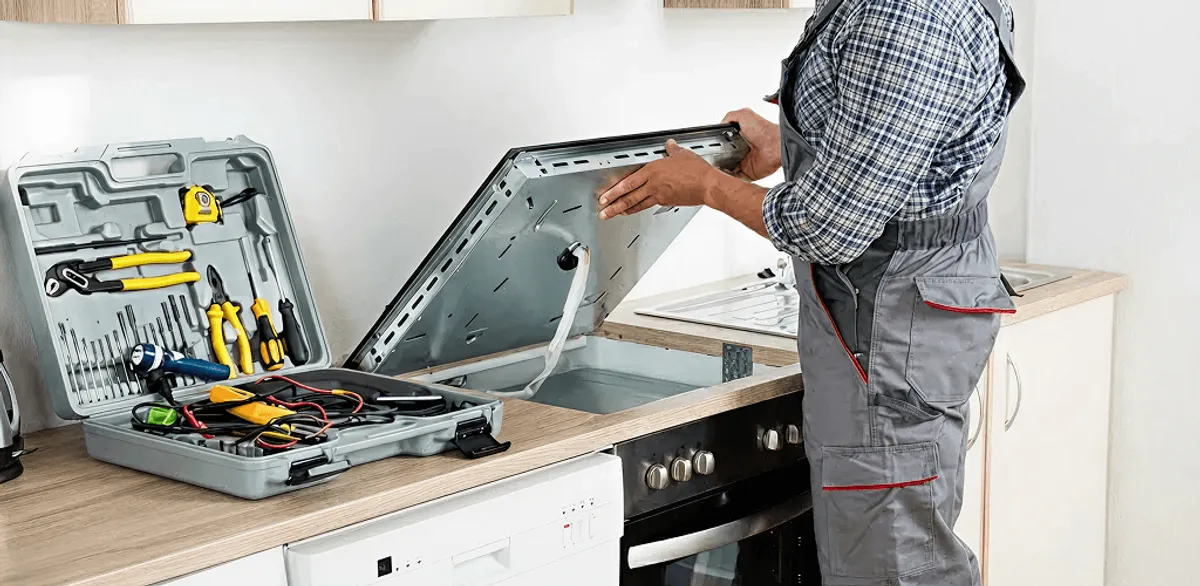 Handyman repairing a cooktop and checking wiring connections in Scottsdale, AZ