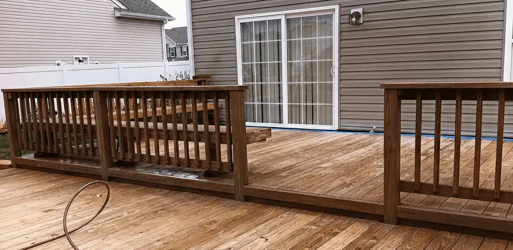 Deck sealing service protecting a backyard wood deck and railings in Scottsdale, AZ