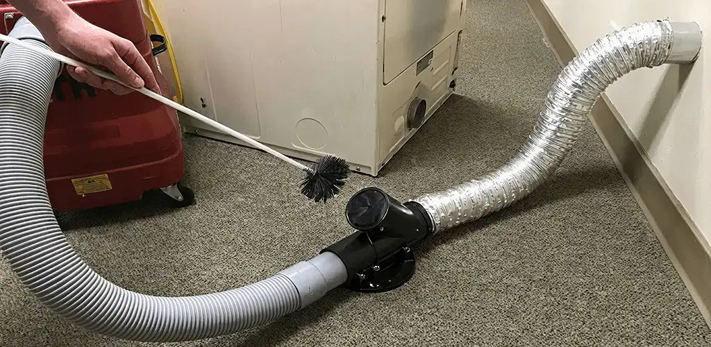 Dryer vent cleaning service removing lint from a dryer duct connection in Scottsdale, AZ
