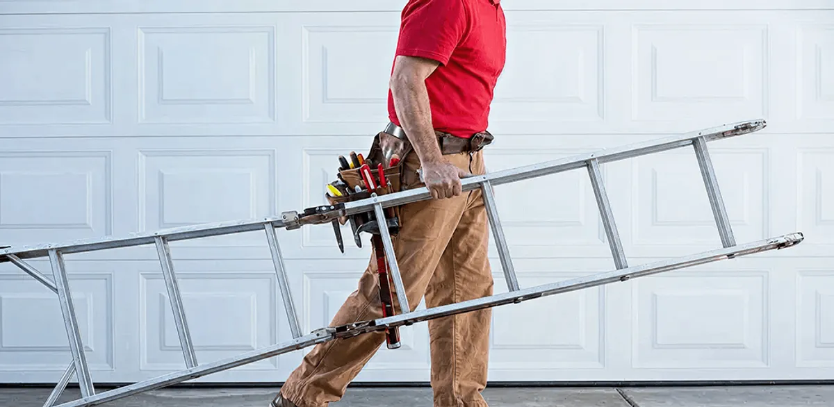 Garage door repair technician arriving with tools and ladder in Scottsdale, AZ