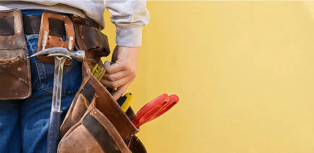 Handyman with tool belt ready for home repairs and maintenance in Scottsdale, AZ